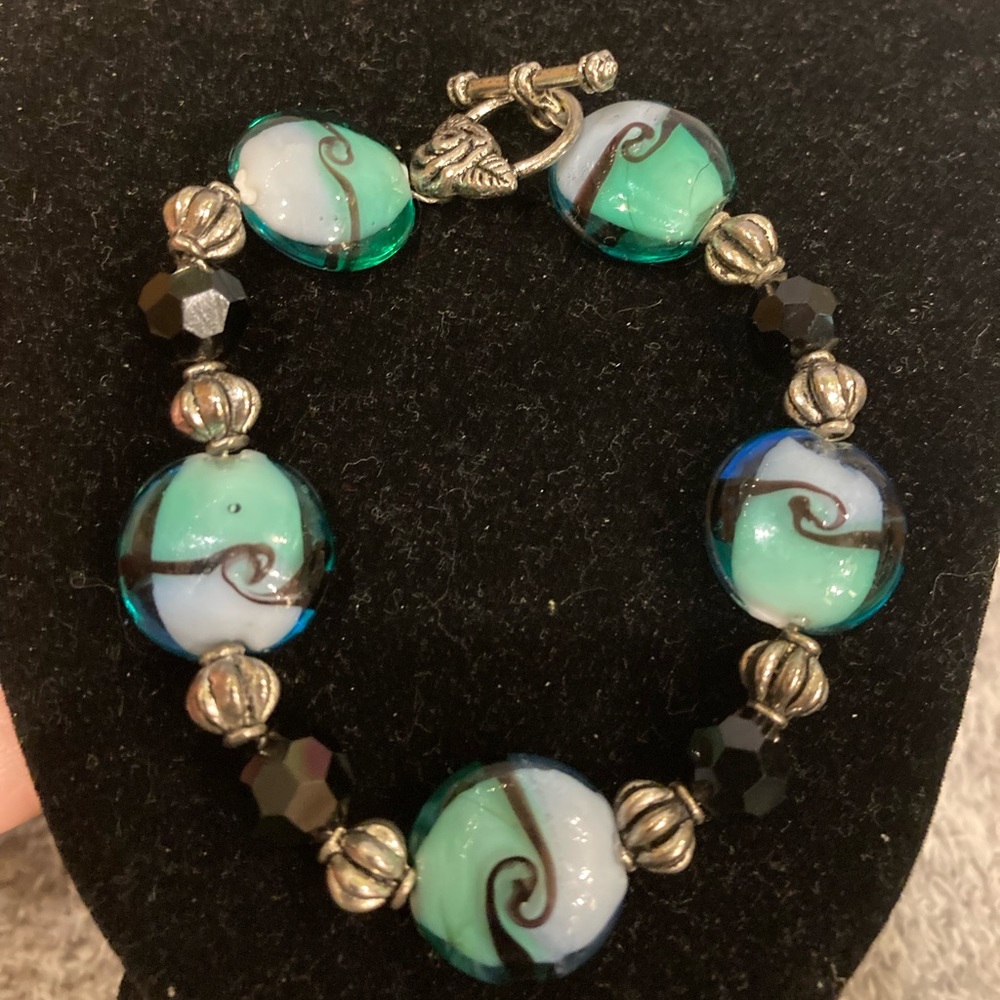 Pretty colorful bracelet, almost has a sea glass look to it